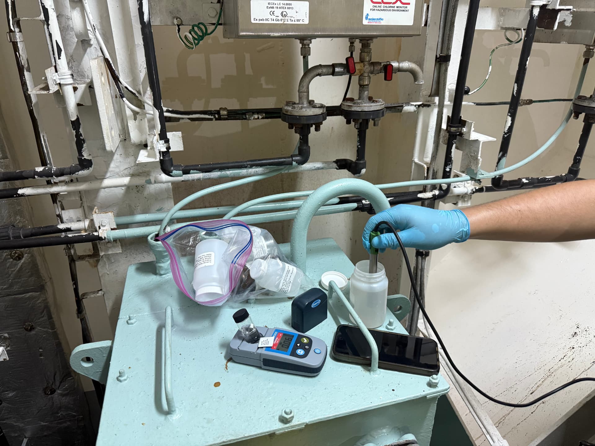 Sample bottles and field meters at a vessel sample point