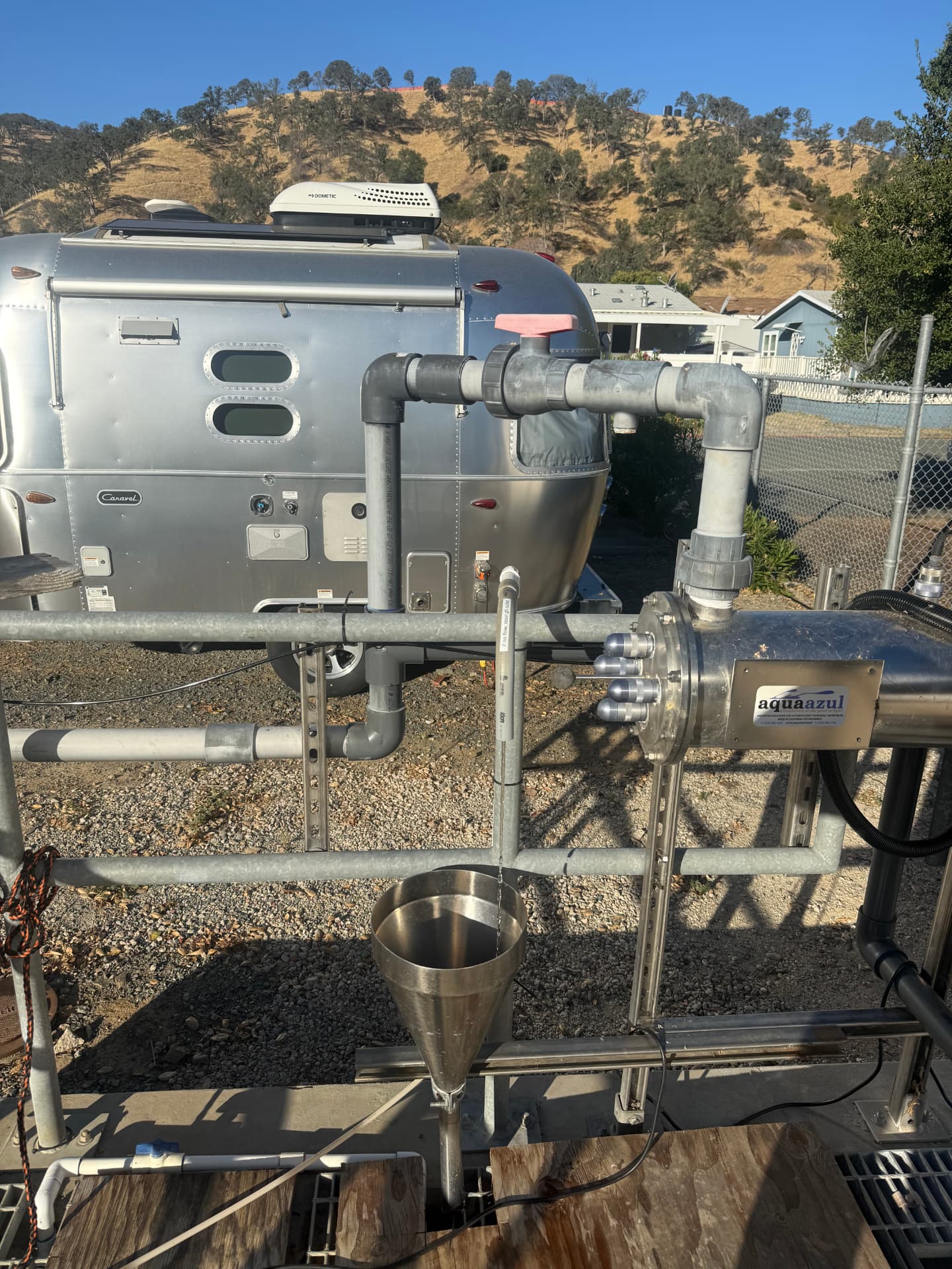 AquaAzul treatment skid with sampling port at a field site.